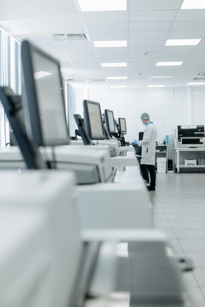 Medical professional in a modern lab using advanced equipment for research.